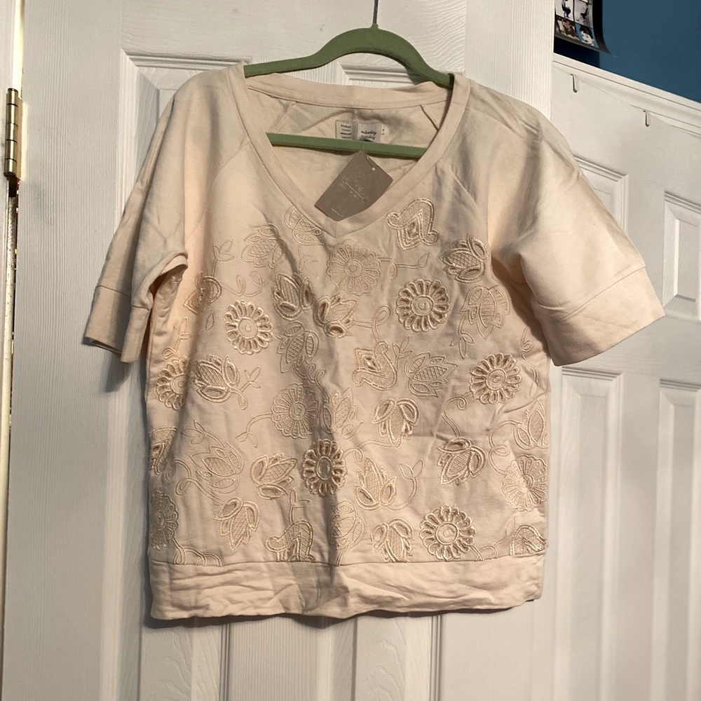 Anthropologie cream colored fancy tee